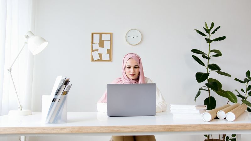 desk styled with blush pink accents and brass hardware