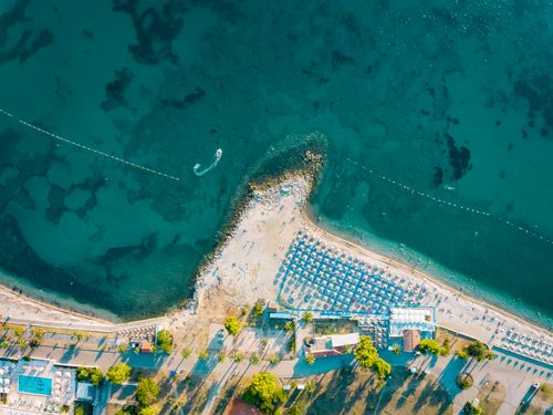 Free Stunning aerial view of a beach in Bar, Montenegro, showcasing turquoise waters and vibrant summer scenery. Stock Photo