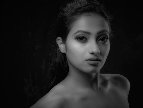 A Grayscale Photo of a Topless Woman