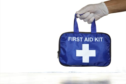 Free Person Holding First Aid Kit Stock Photo