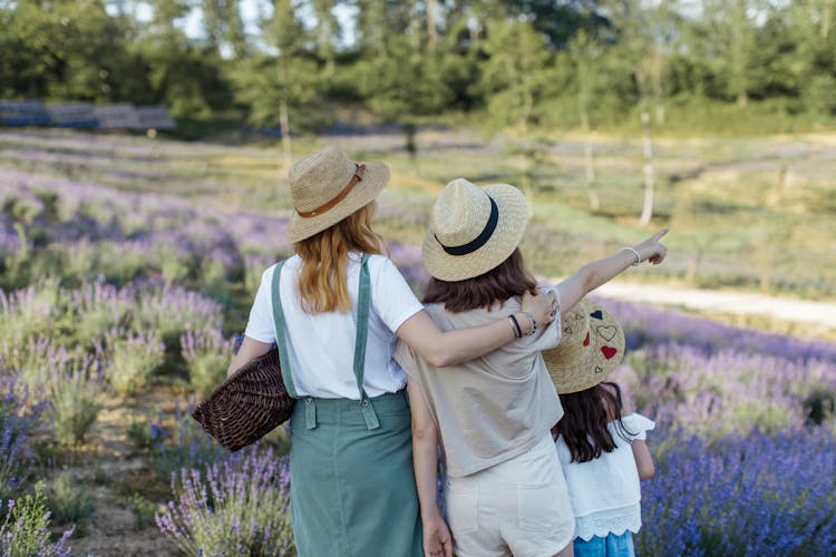 Back View Of A Mother With Her Daughters