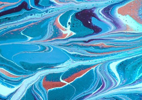 Colorful swirling abstract painting in blue and turquoise tones.