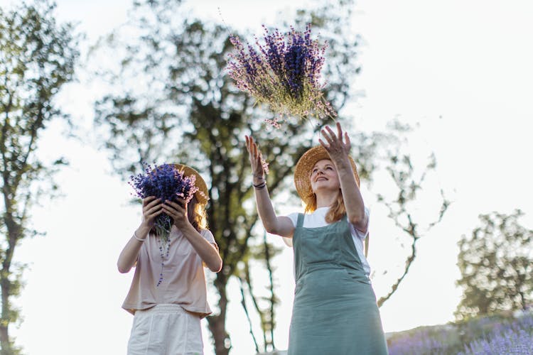 People Throwing Lavender Flowers