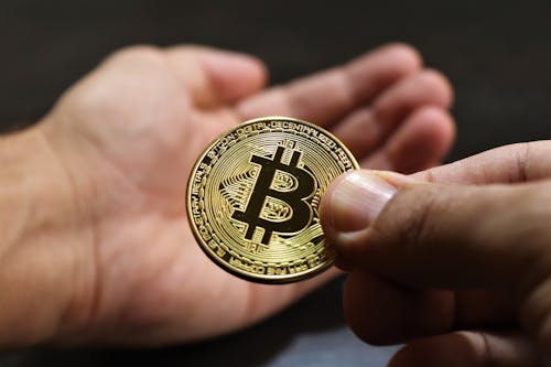 Free Person Holding Bitcoin Stock Photo