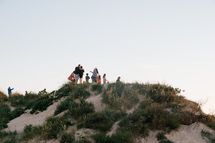 A Group Of People On A Hill