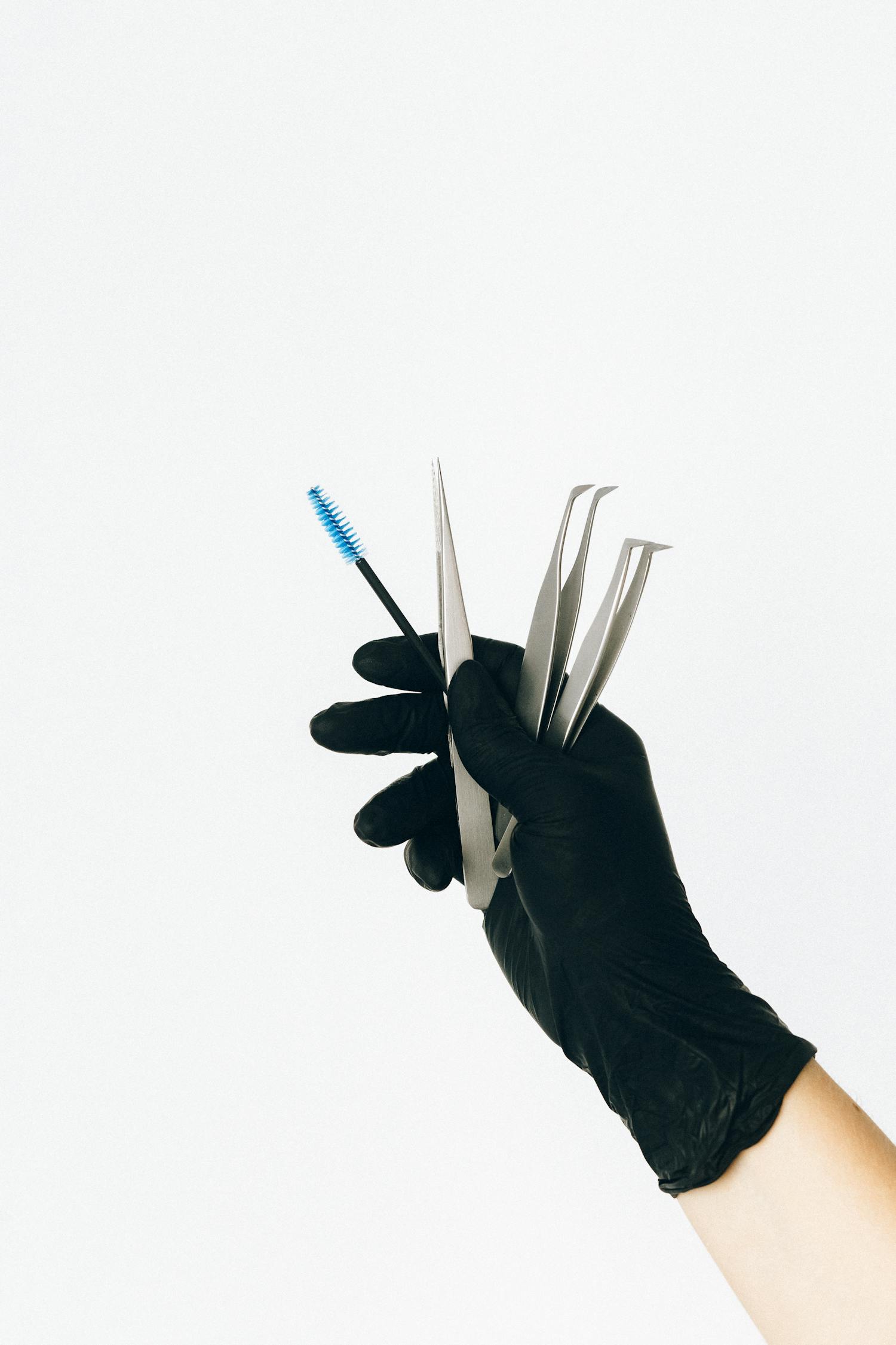 Person Holding White and Blue Pen · Free Stock Photo