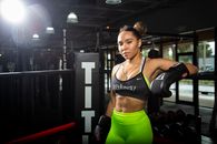 Woman at the Gym Wearing Boxing Gloves 