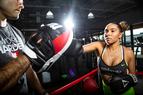 Woman in Black and Red Boxing Gloves