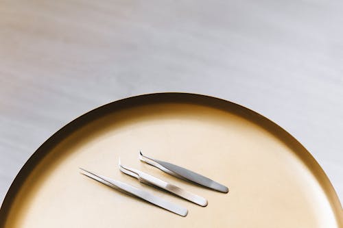 Free Silver Fork and Bread Knife on Brown Round Plate Stock Photo