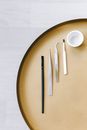 White Plastic Fork and Knife on Brown Round Plate