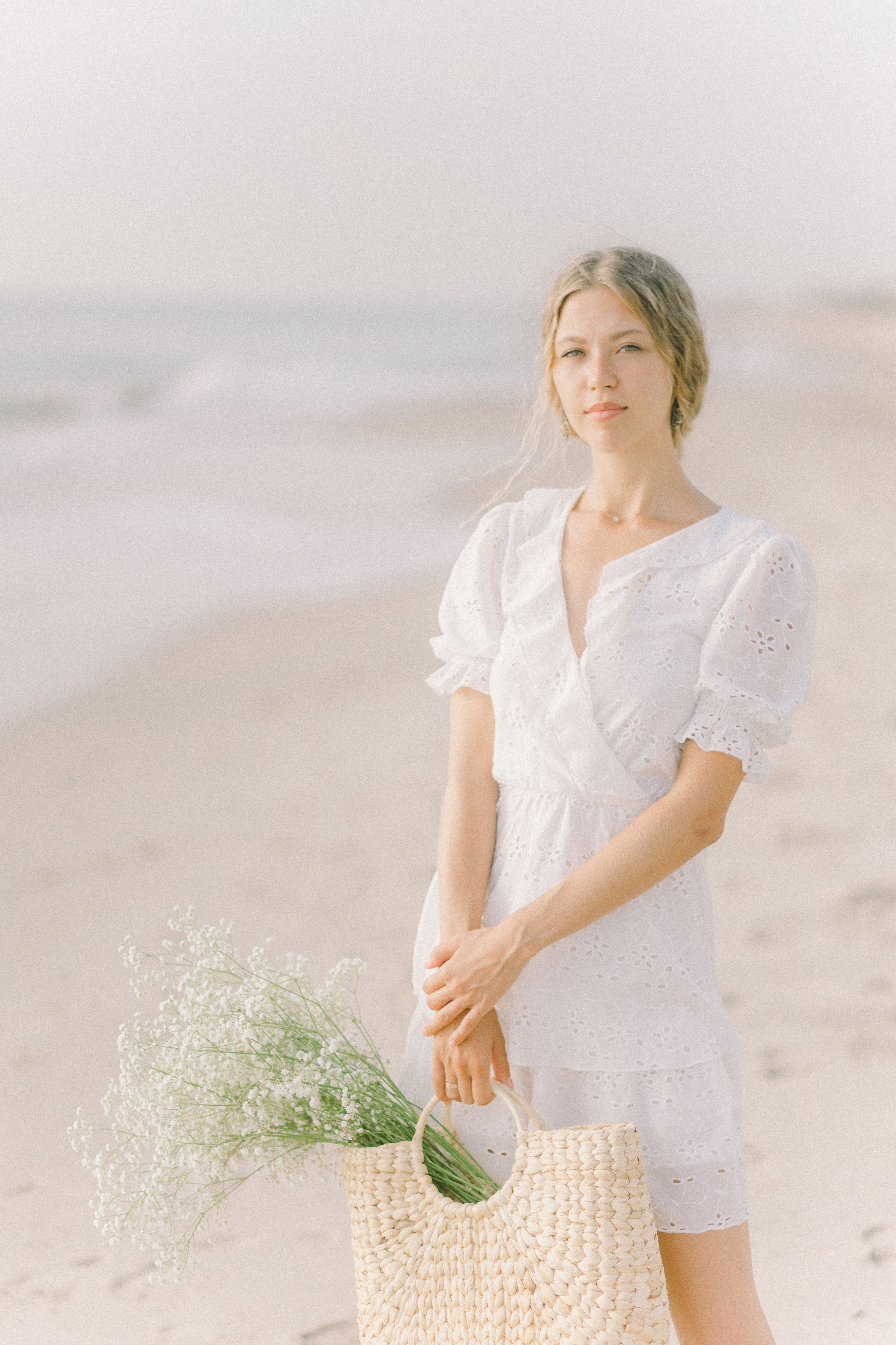 Woman in White Dress Holding Basket of Flowers · Free Stock Photo
