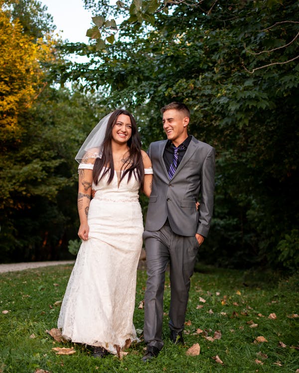 Happy newlywed couple in park