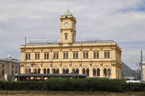 Free Historic Leningradsky Railway Station in Moscow with iconic clock tower. Stock Photo