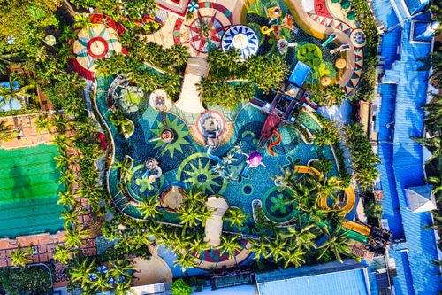 Free Colorful aerial shot of a water park in Banten, Indonesia, showcasing vibrant design and lush greenery. Stock Photo