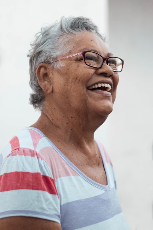 Optimistic senior woman looking away
