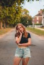 Teenage Girl Standing on Countryside Road