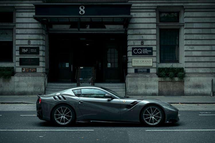 Gray Ferrari On Asphalt Road