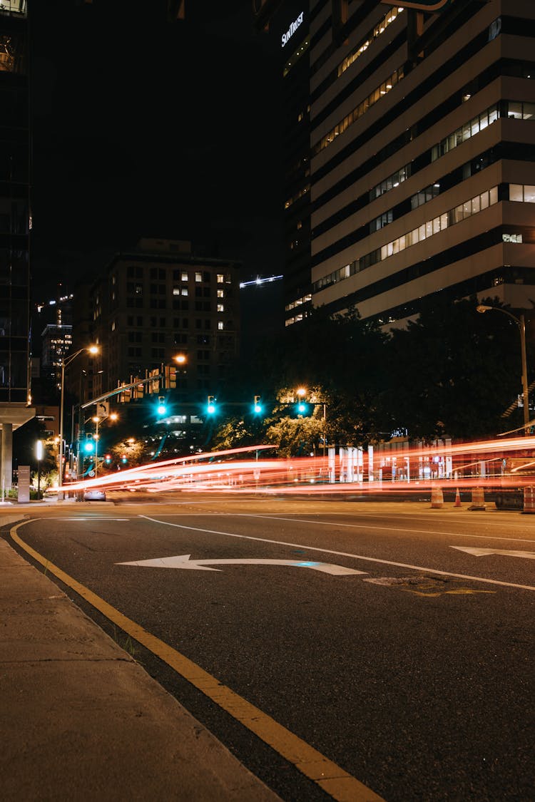 Empty Road And Green Lights In Night City Downtown