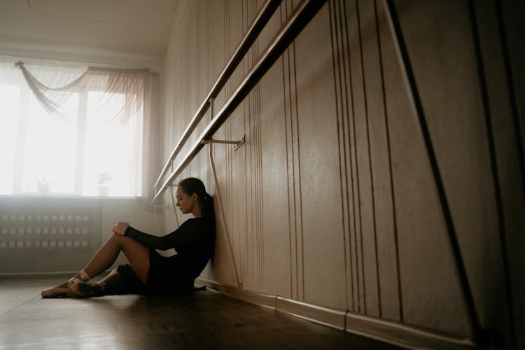 Ballet Dancer Sitting On Floor