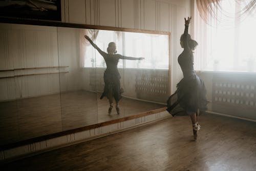 Free Woman Dancing Ballet Gracefully Inside Studio Stock Photo