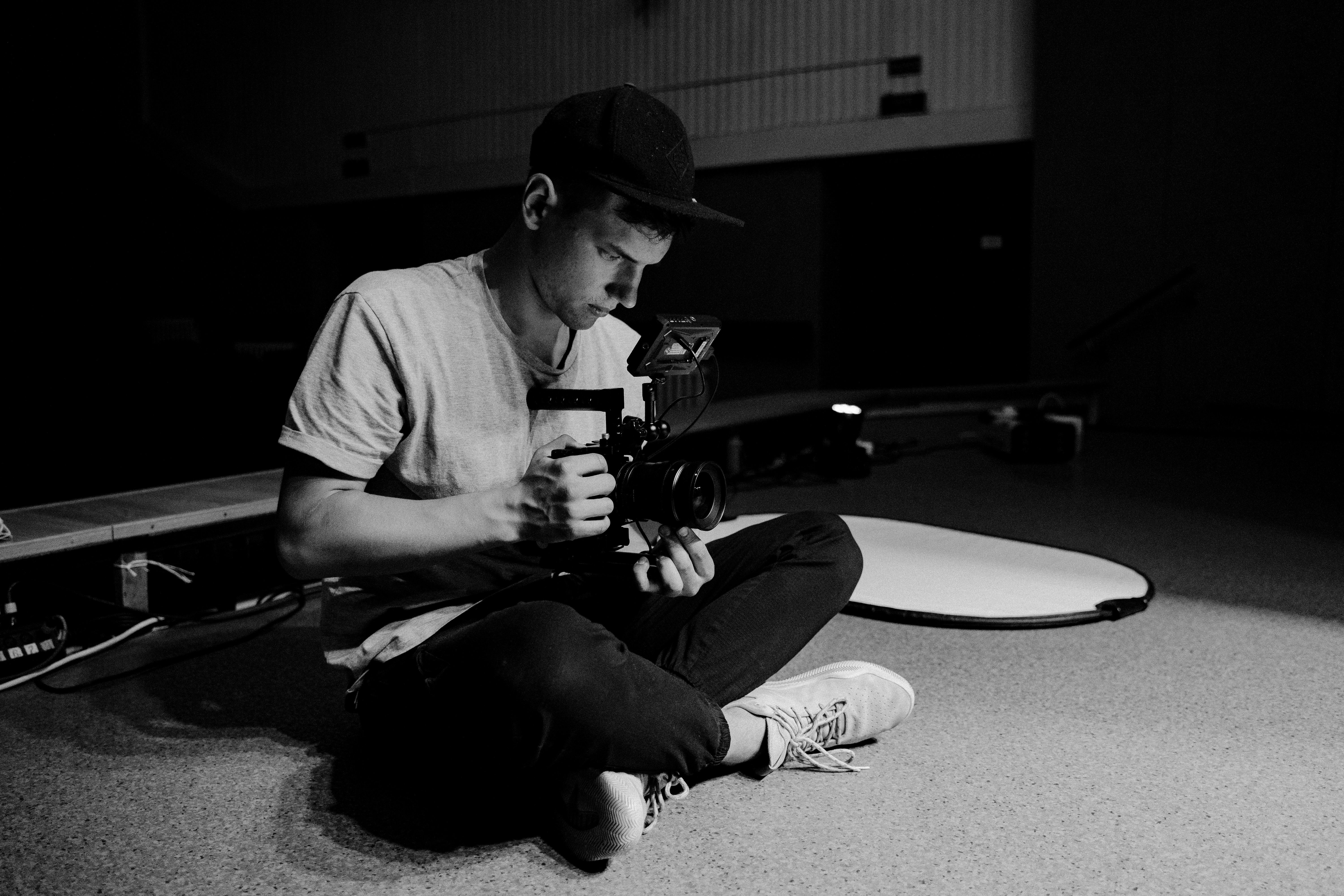 Man Holding a Dslr Camera · Free Stock Photo
