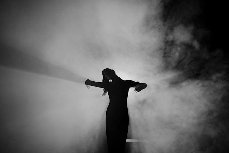 Silhouette Of Woman Doing A Dance Pose