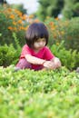 Girl Sitting in Garden