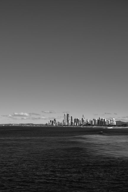A captivating black and white cityscape of Gold Coast, Australia, with ocean view.