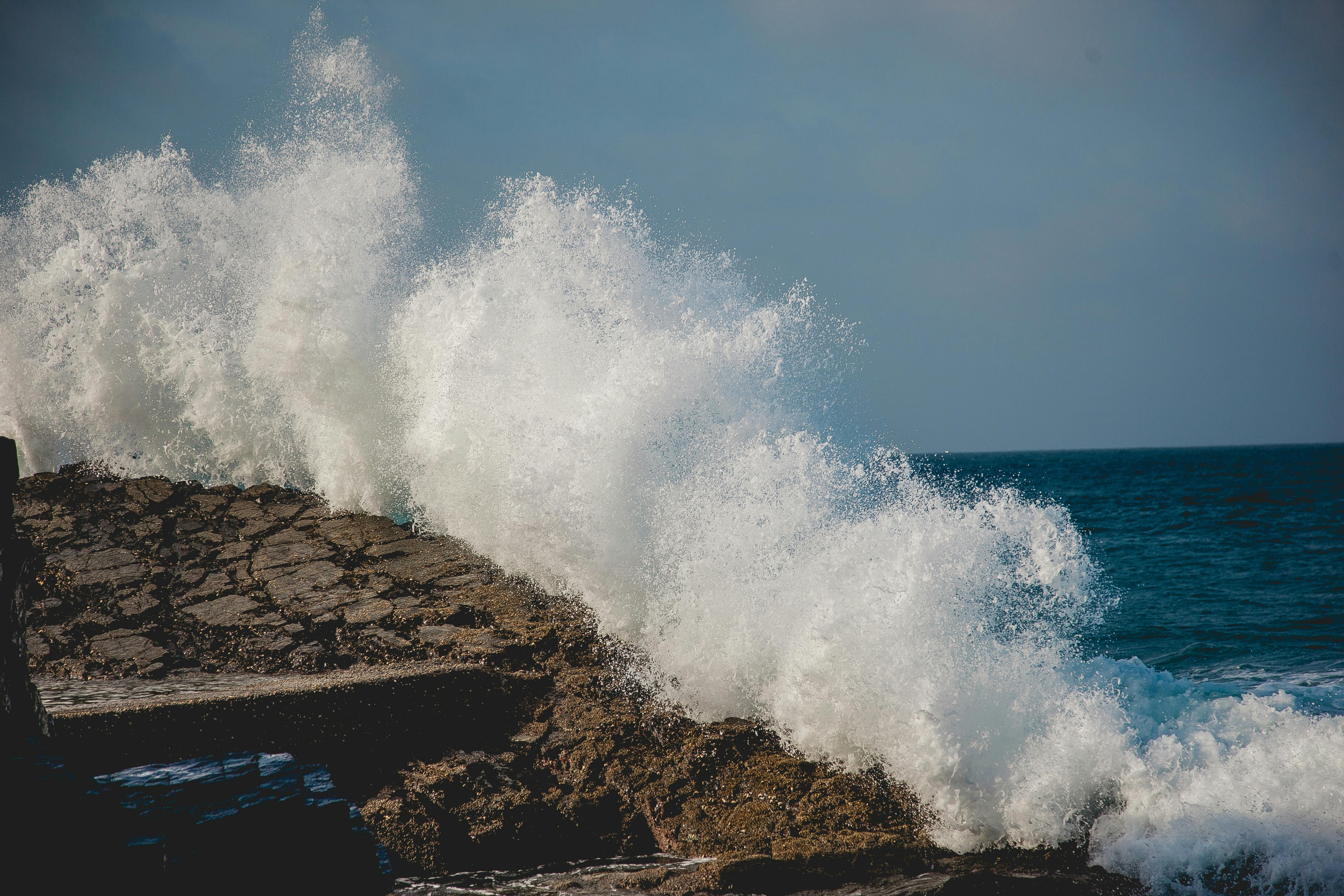 Sea Waves Hitting The Rock During Daytime · Free Stock Photo