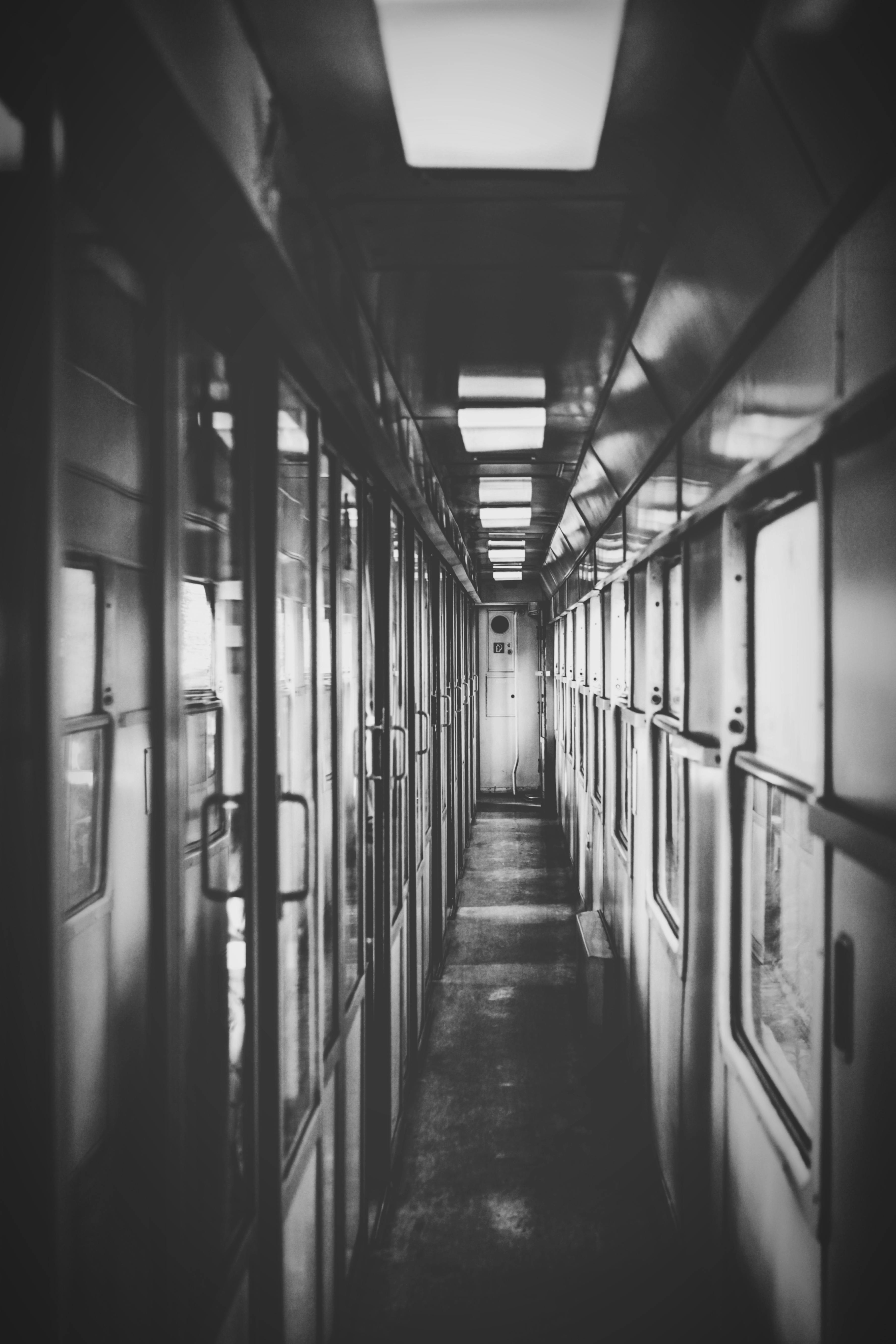 Grayscale Photography of Train Car Interior · Free Stock Photo