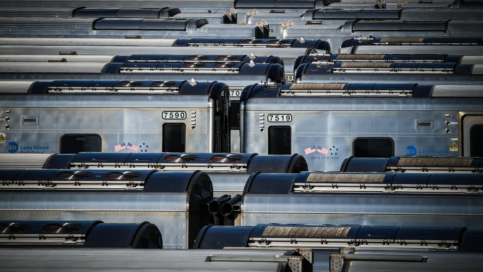 Aerial view of Long Island Rail Road trains parked at a depot showcasing urban transportation.