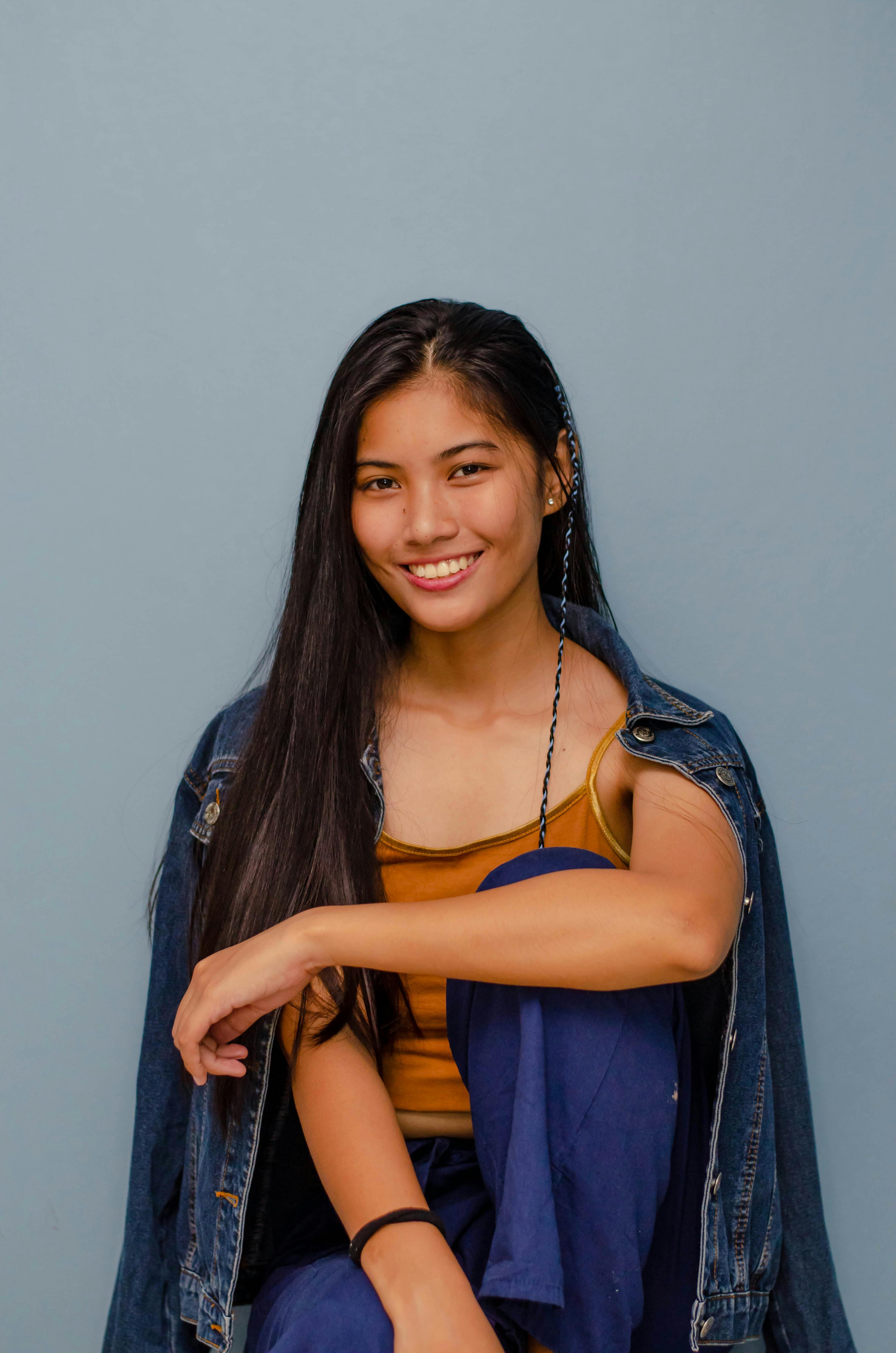 beautiful woman wearing denim jacket smiling