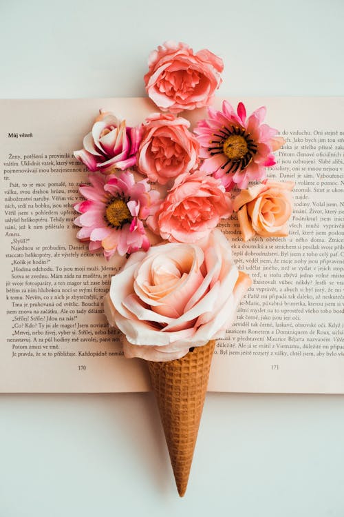 Flowers and Ice Cream Cone on Book Pages