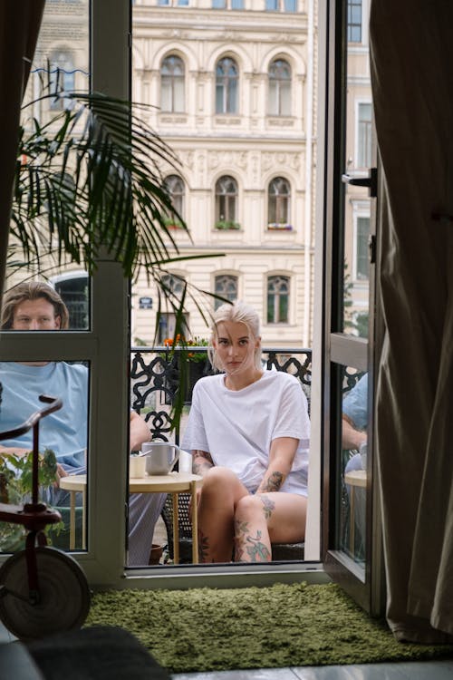 A Couple Sitting on the Balcony