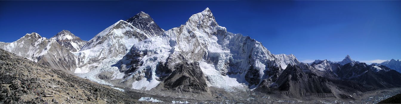 Mountain Filled With Snow Under Blue Sky during Daytime