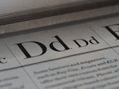 D Letters in Newspaper