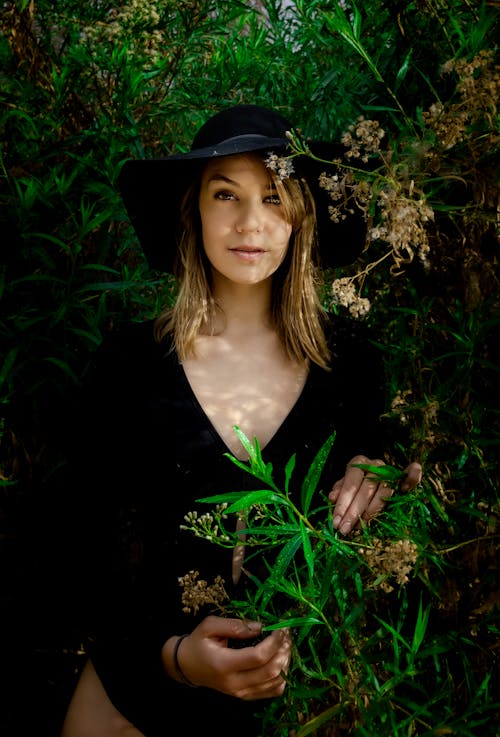 Portrait of Woman Surrounded by Lush Foliage