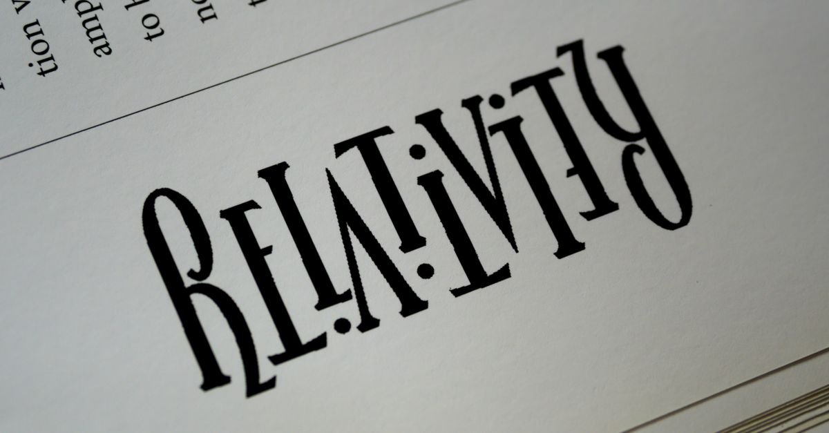 Close-up of artistic typography with the word Relativity printed on paper.
