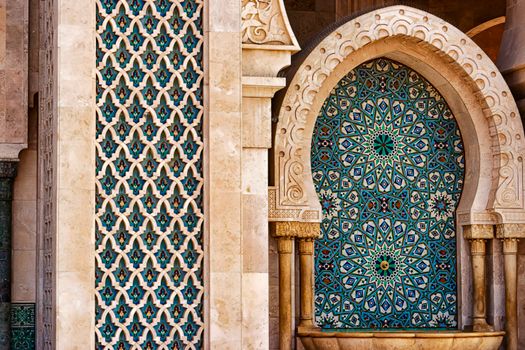 Detailed view of traditional Moorish tilework showcasing intricate patterns and vibrant colors in historic architecture.