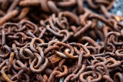 A detailed close-up of rusty chains showcasing texture and decay.