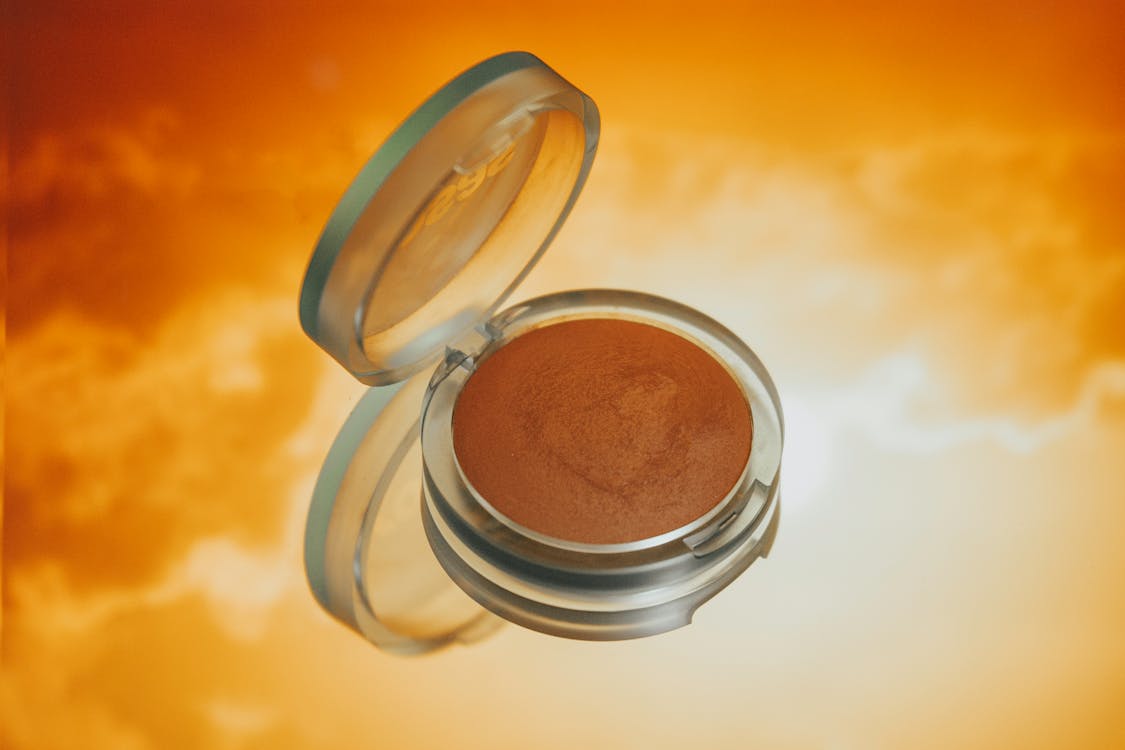 Clear Glass Mug With Brown Liquid, Makeup Essentials