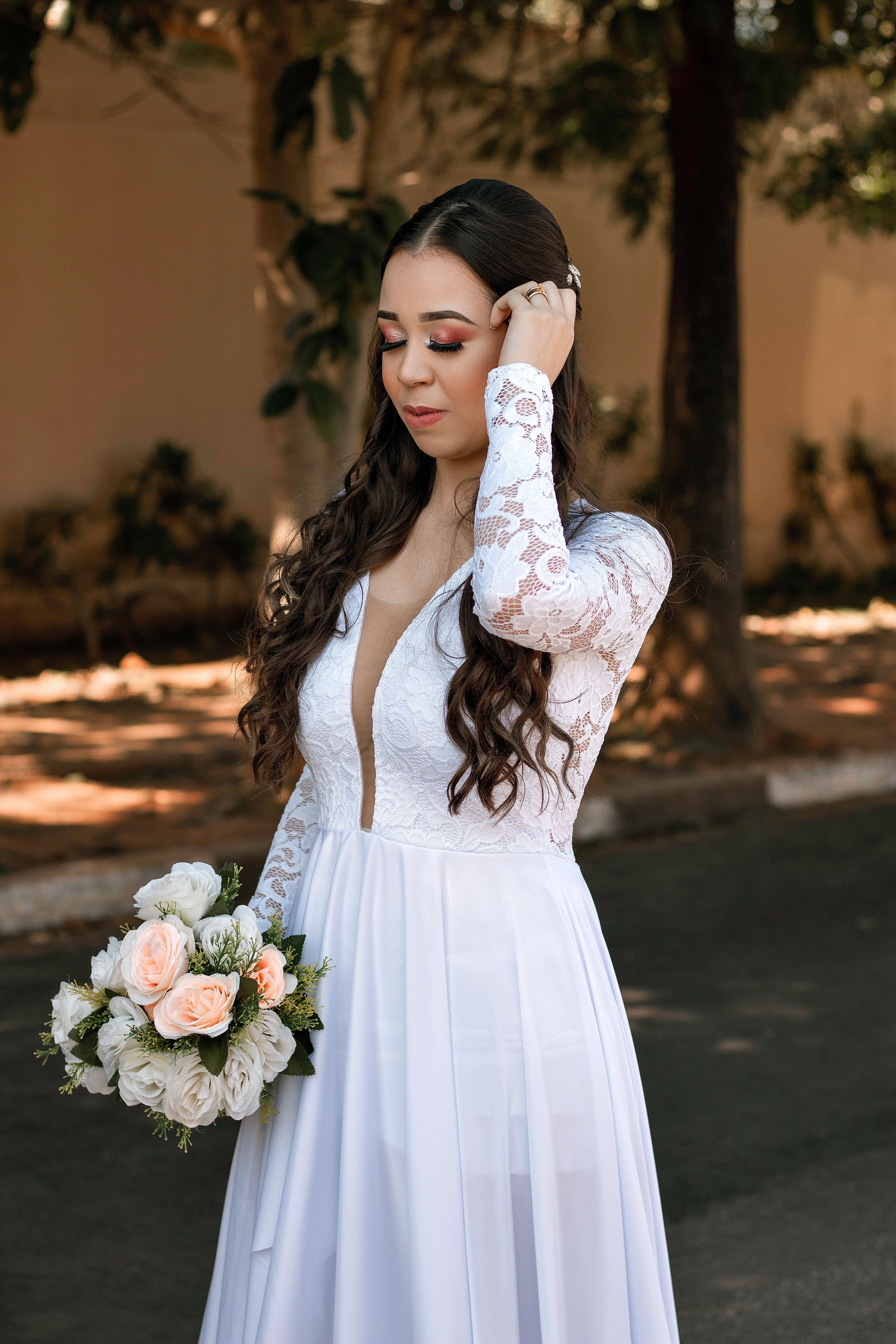 Woman in White Dress Holding Bouquet of Flowers · Free Stock Photo