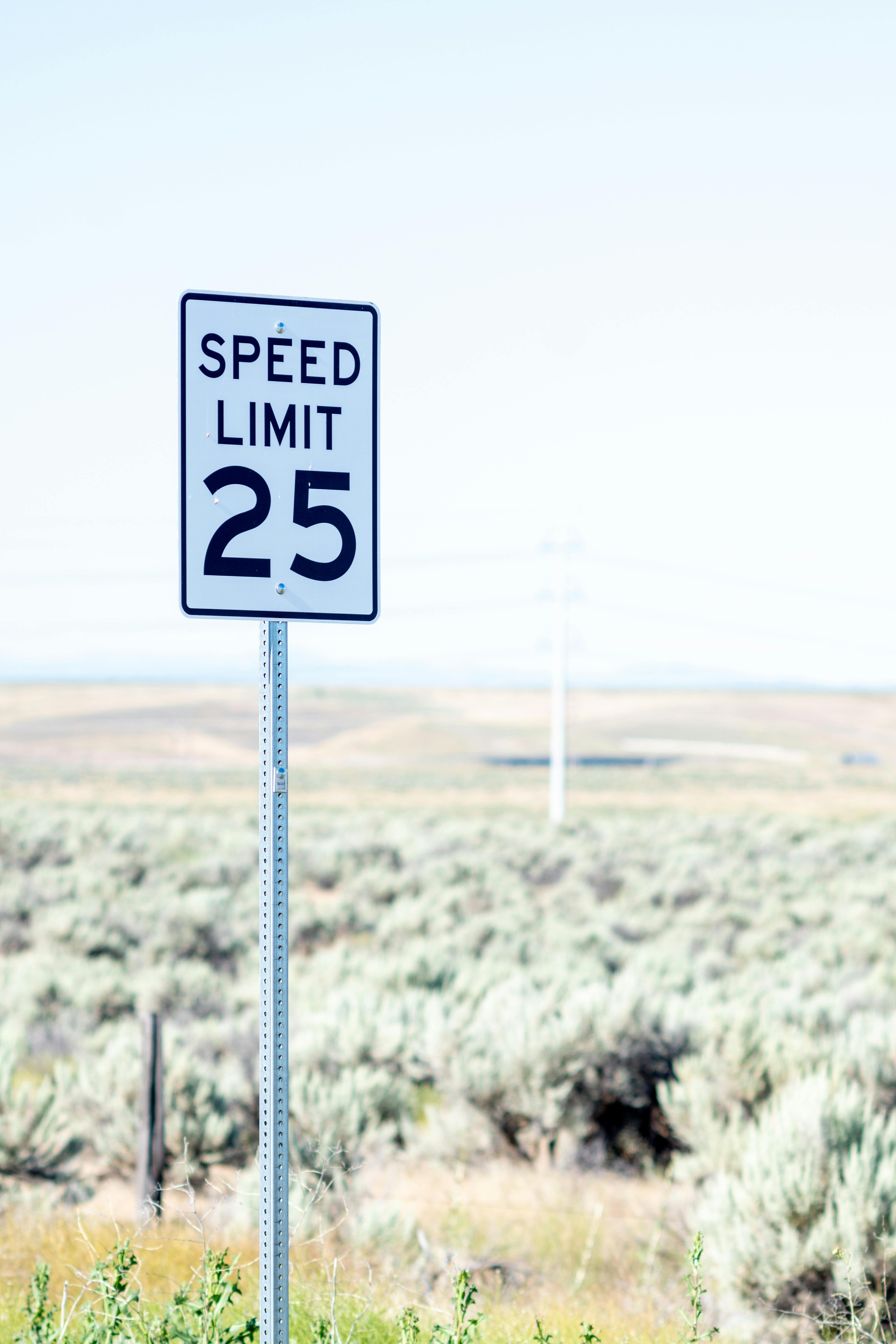 speed limit sign on road in countryside