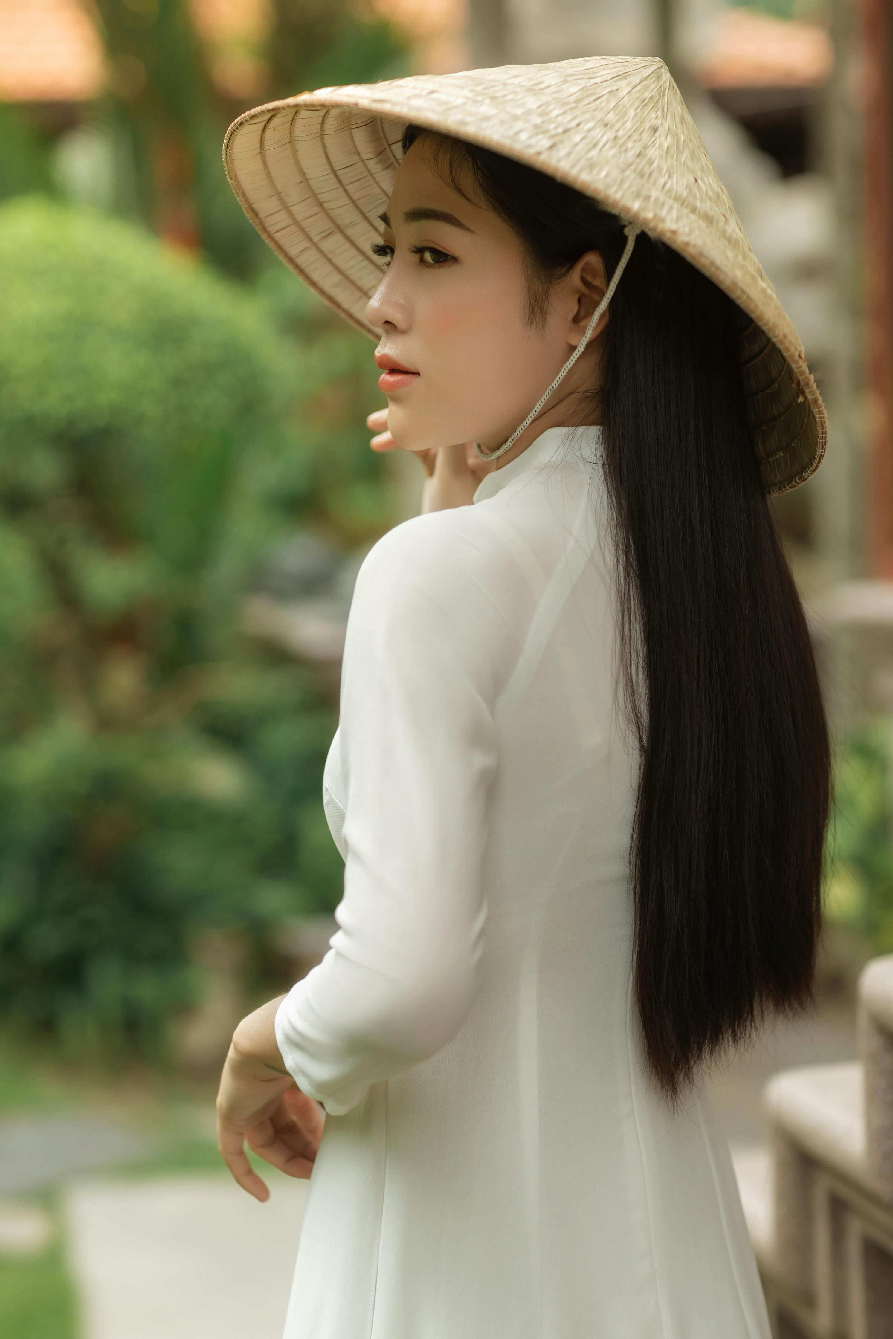 Beautiful Woman Wearing a Conical Hat · Free Stock Photo Beautiful Woman Wearing a Conical Hat · Free Stock Photo