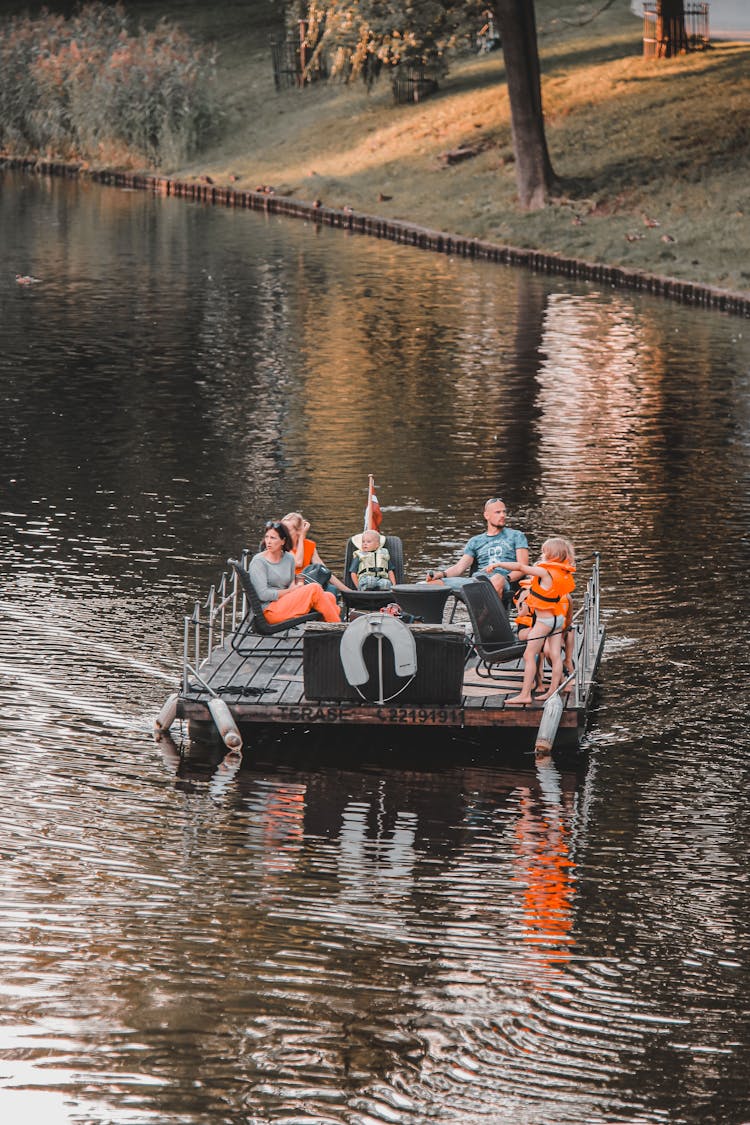 A Family Relaxing In A Floating Platform