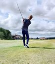 Man in Blue Denim Jeans Playing Golf