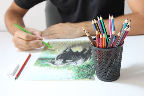 Person Drawing with Color Pencils