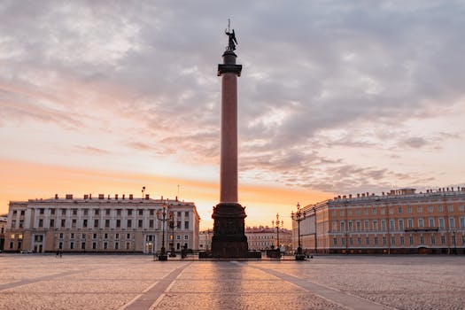 The Alexander Column in Saint Petersburg framed by a stunning evening sky, capturing historical elegance.