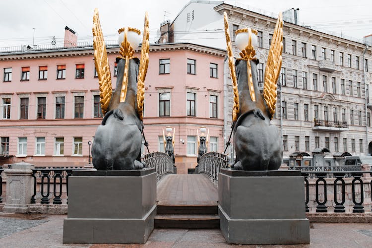 Gilded Wings Of Griffin Statues 