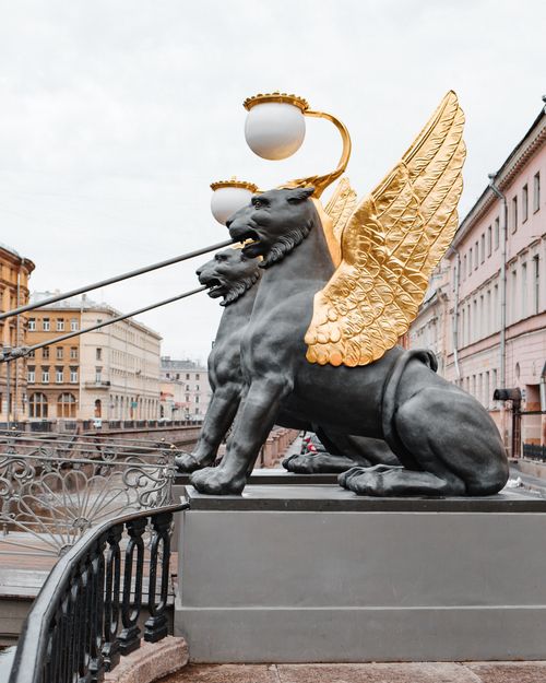 Free Stunning view of the iconic golden winged lion statues on the Bank Bridge in Saint Petersburg, Russia. Stock Photo